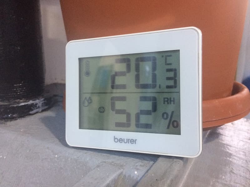 A digital hygrometer showing around 50% relative humidity