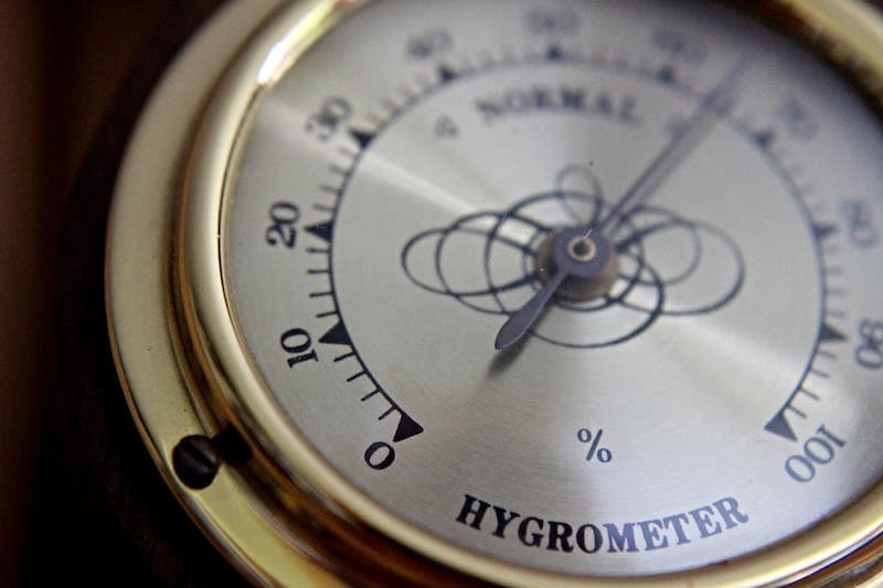 Hygrometer showing a high humidity of 65 percent